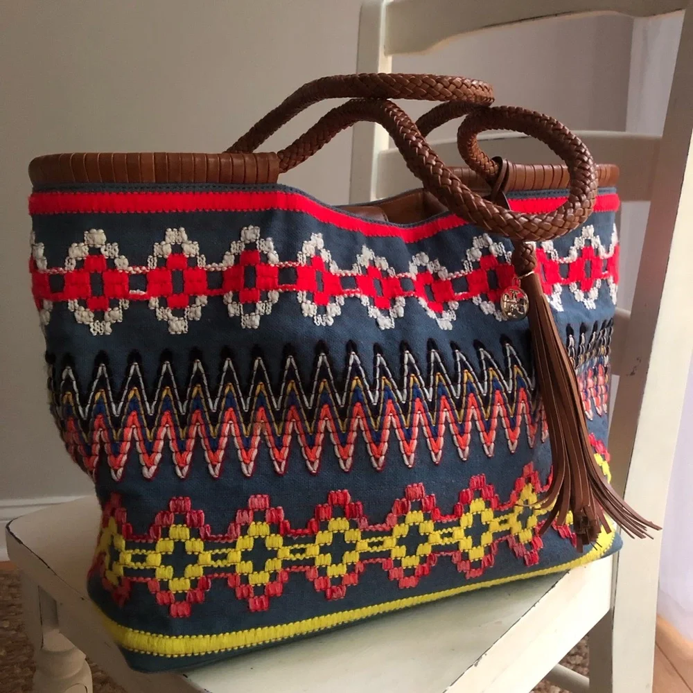 Tory Burch measured approximately